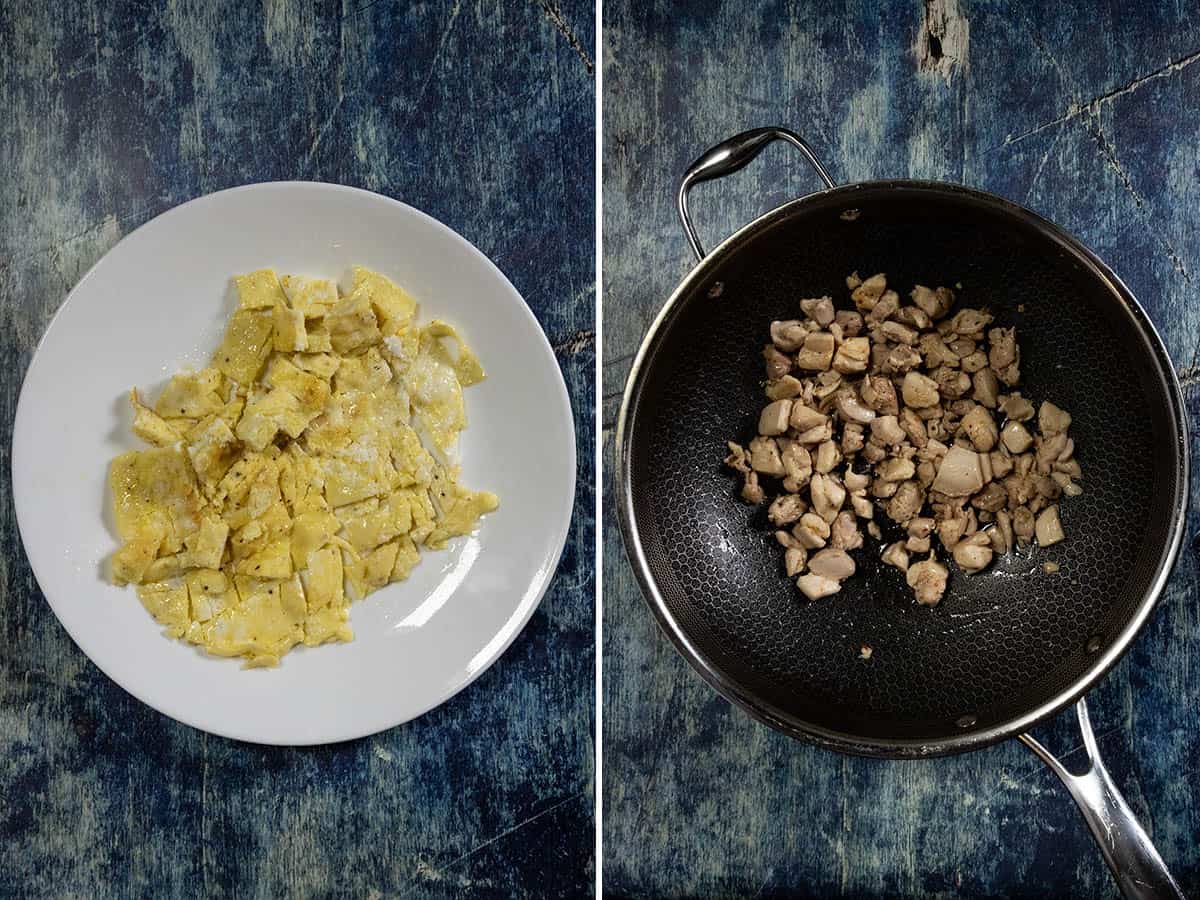 Stir frying scrambled egg and chunks of chicken in a hot pan to make Arroz Chaufa (Peruvian Fried Rice with Chicken)