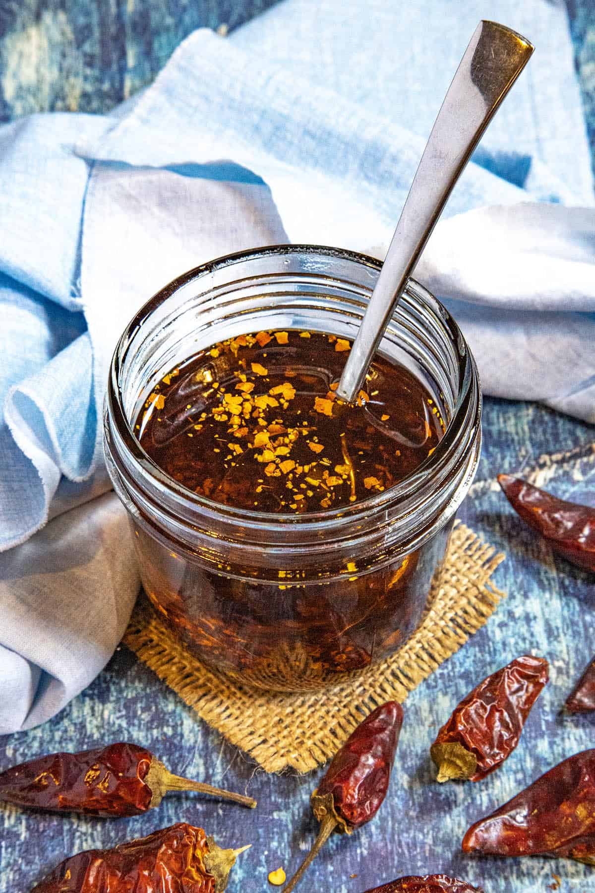 A small jar filled with Calabrian Chili Oil (Olio Santo)