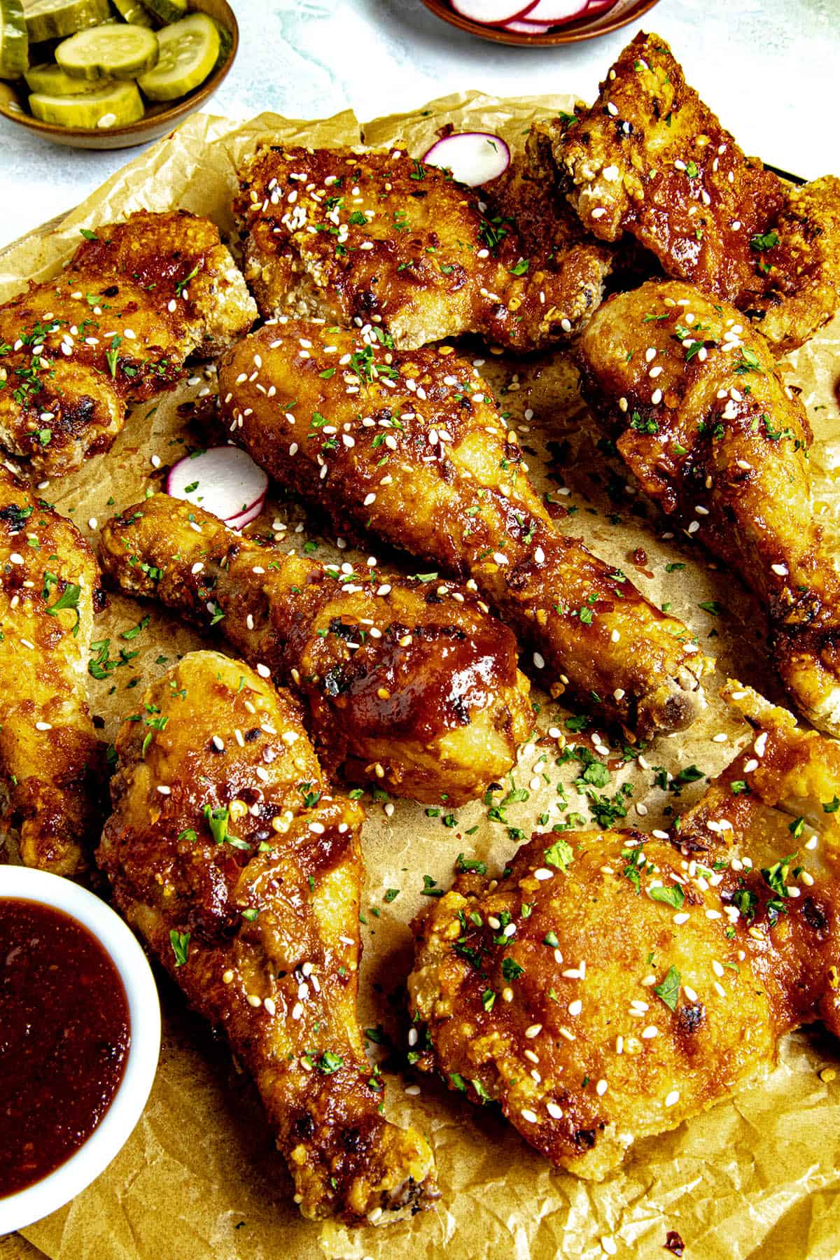 Crispy Korean Fried Chicken (Yangnyeom Chicken) on a serving platter with gochujang sauce