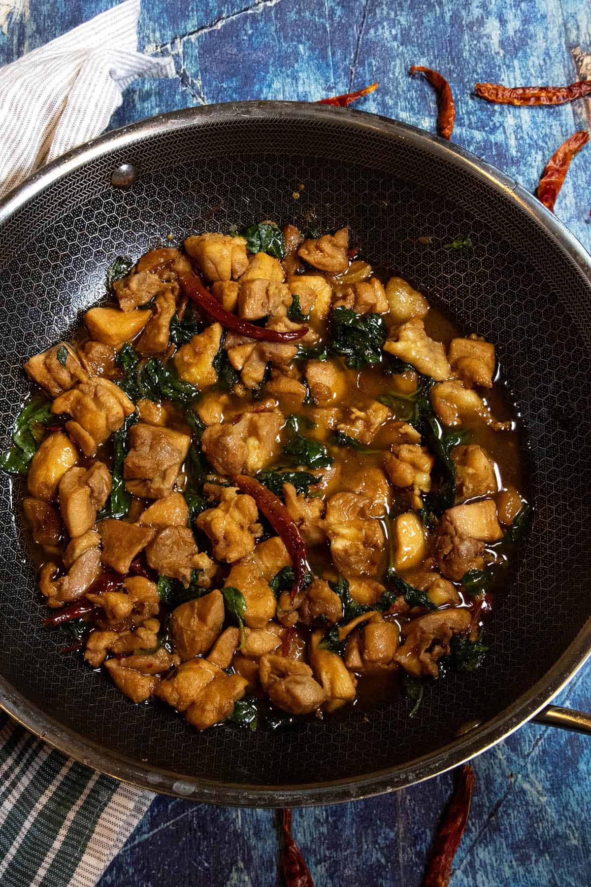 Saucy Three Cup Chicken (San Bei Ji) in a hot wok, ready to serve